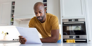 Person looking at paperwork in kitchen