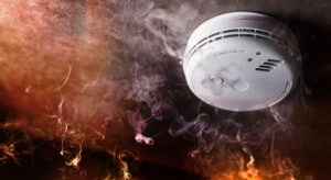 A fire alarm in a smoke-filled room